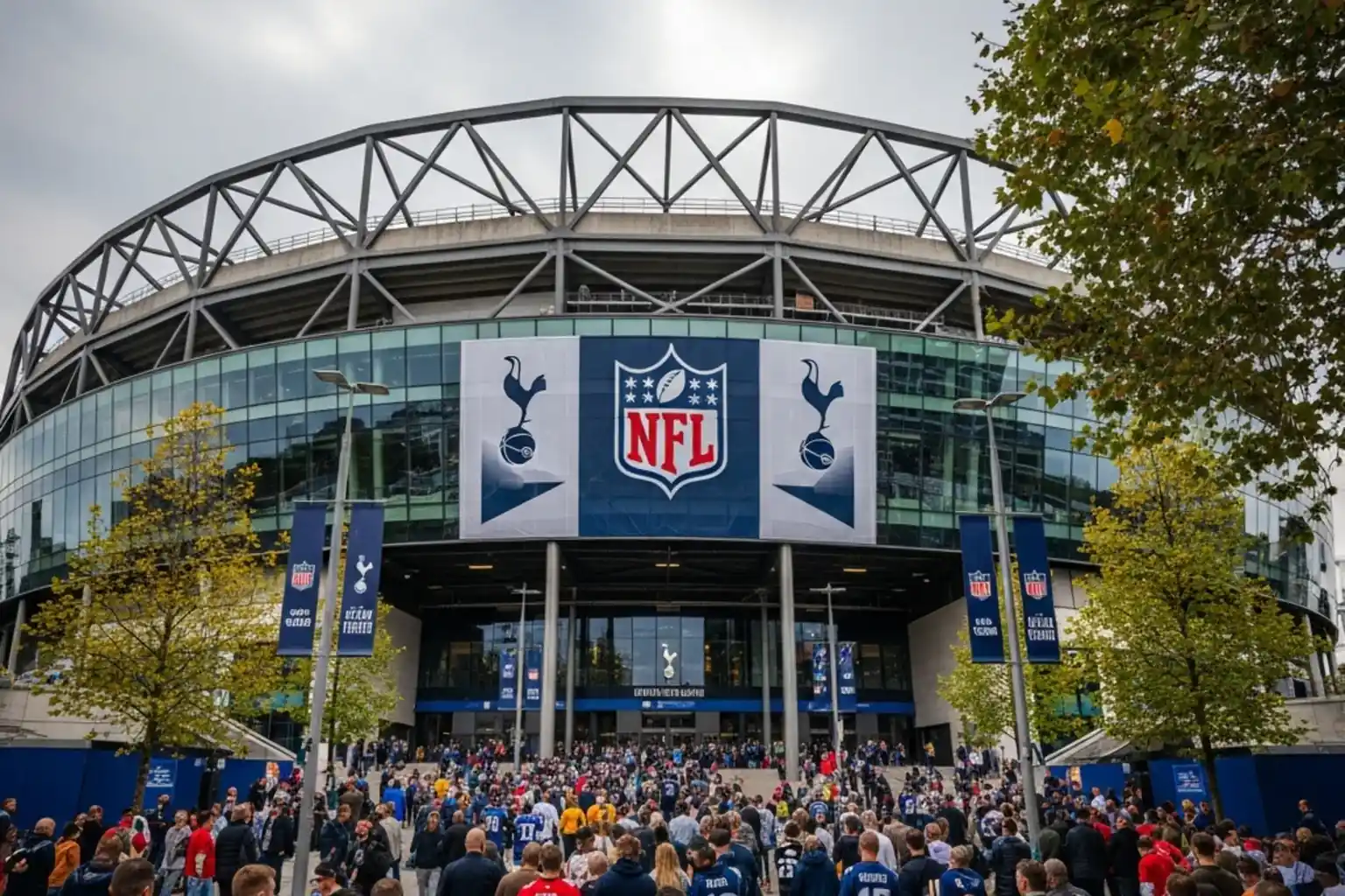 NFL game being played at Tottenham Hotspur Stadium in London with a packed crowd under floodlights